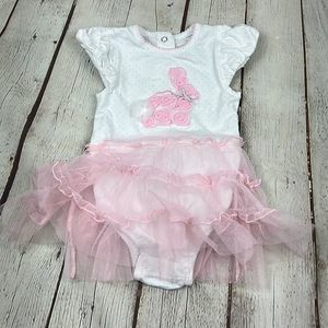 Gigil Easter onesie with attached tutu Baby girl 12mon bunny in the center.